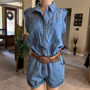 Denim look romper with pockets. Western silver accents and snap buttons
